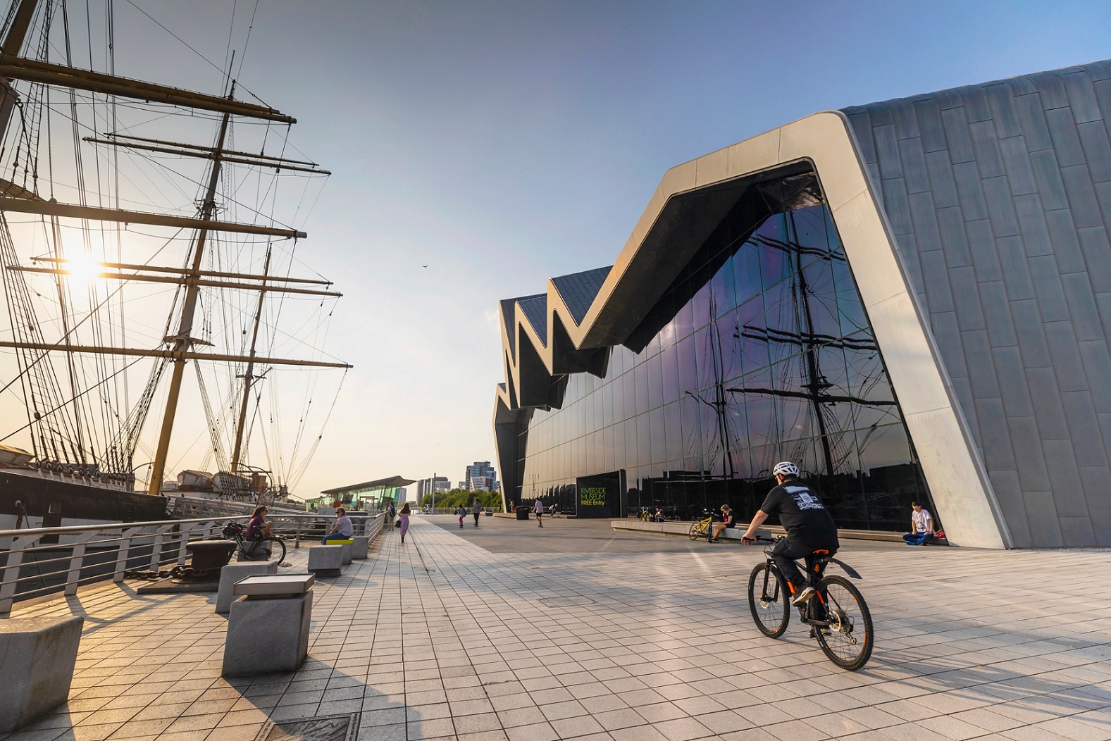 Cyclist passing Riverside Museum, Glasgow