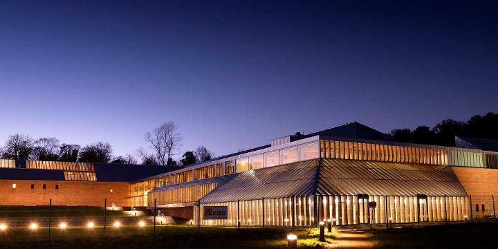 Burrell Collection building lit up at dusk