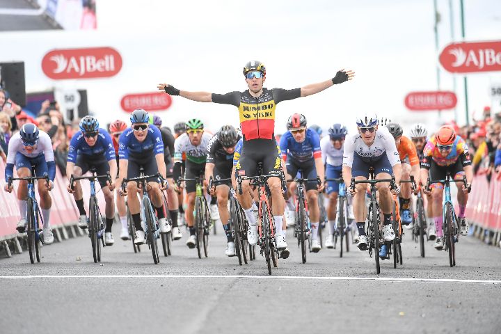 Cyclist celebrates win with outstretched arms