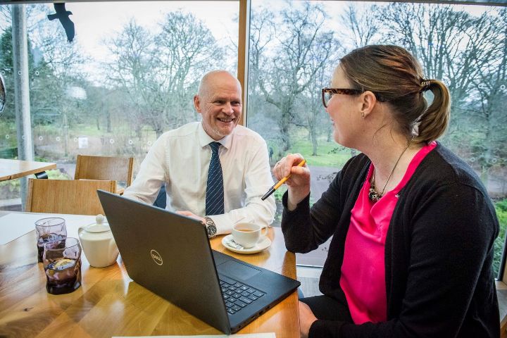 Two people in a business meeting