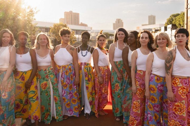 Group of musicians posing for a promotional photograph