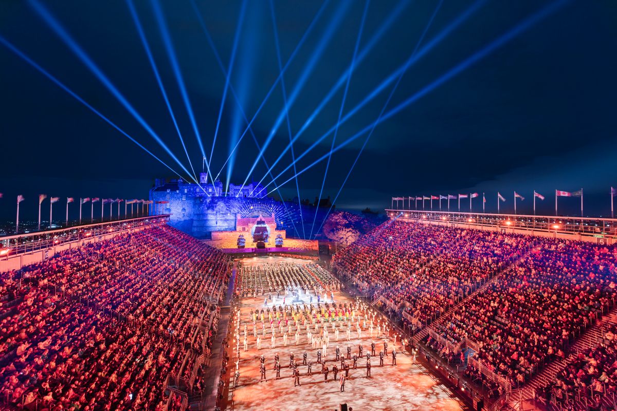Event taking place in front of a castle at night