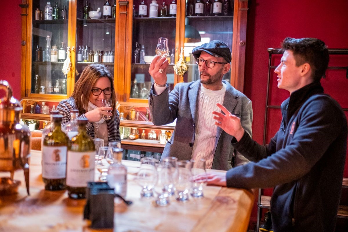 Visitors enjoying whisky during an experience at Lindores Abbey Distillery