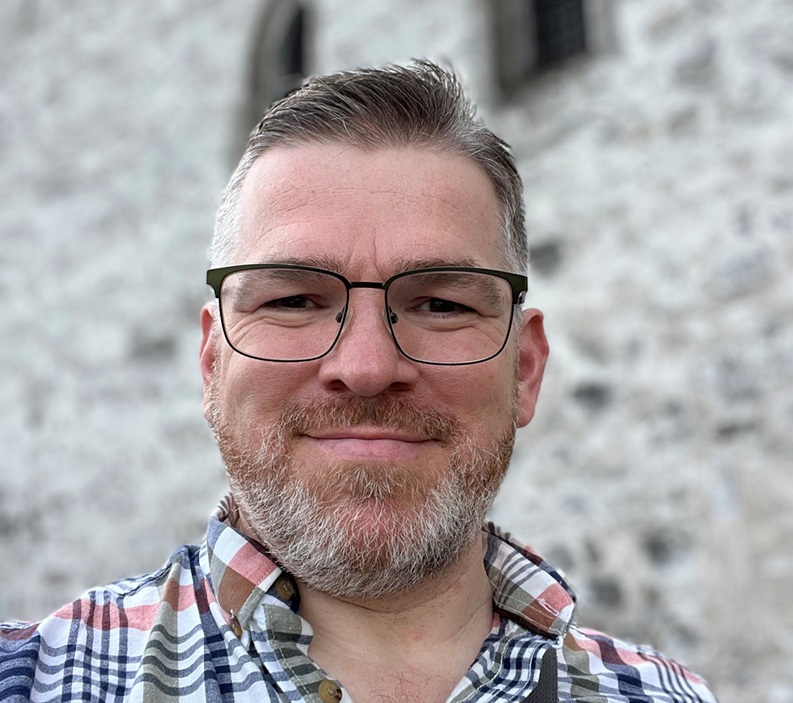 A close up of a person smiling to the camera