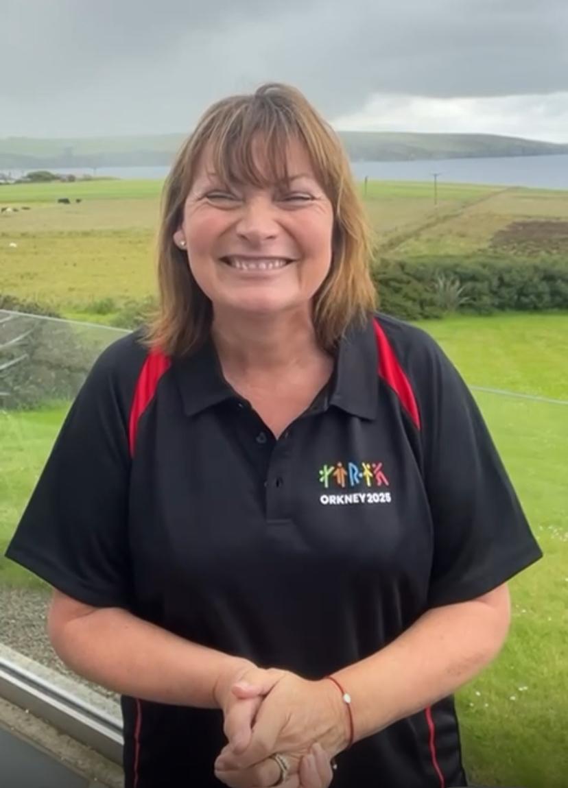 Lorraine Kelly wearing an Orkney 2025 Island Games shirt
