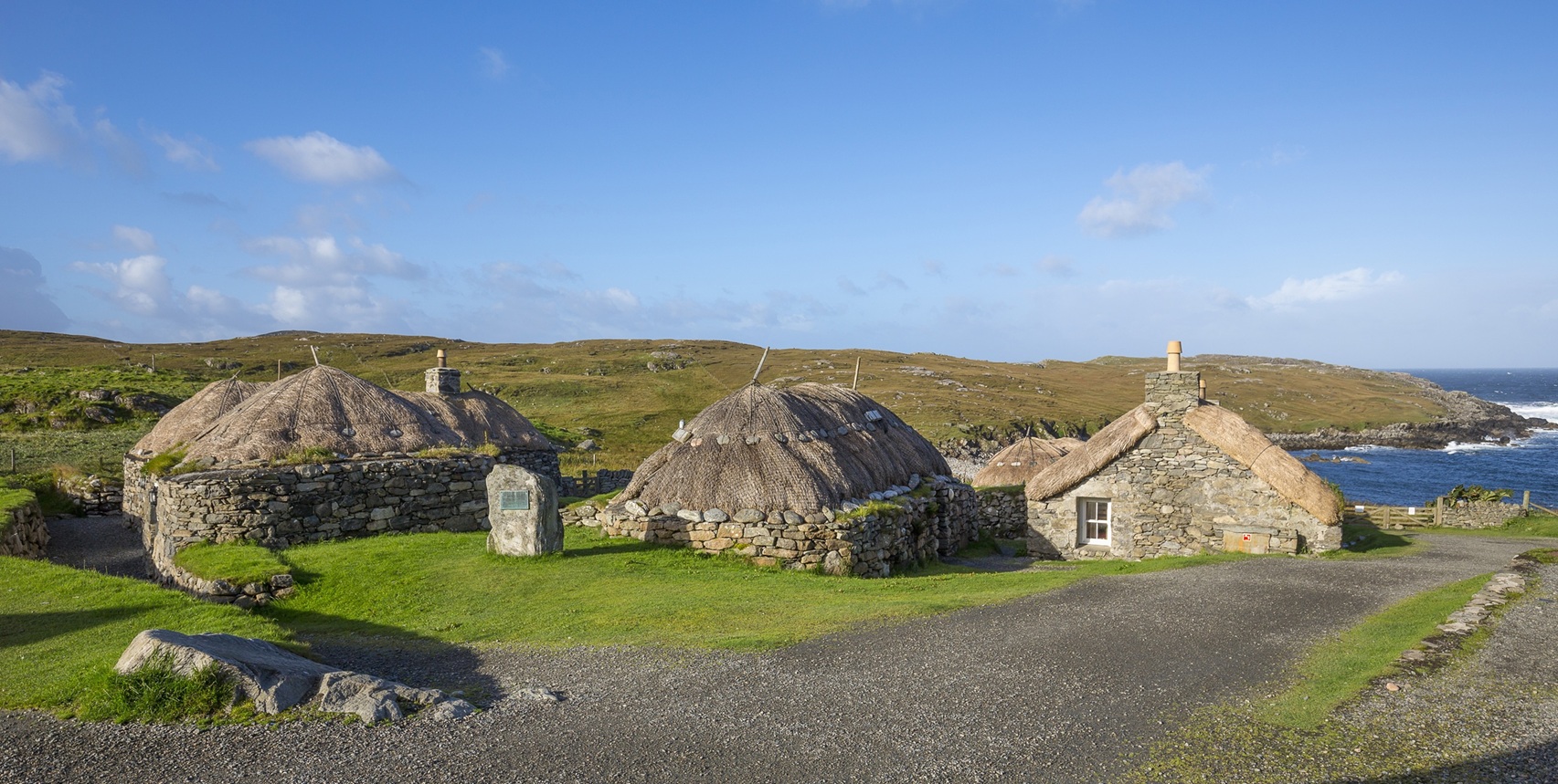 historic settlement surrounded by grass on a sunny clear day