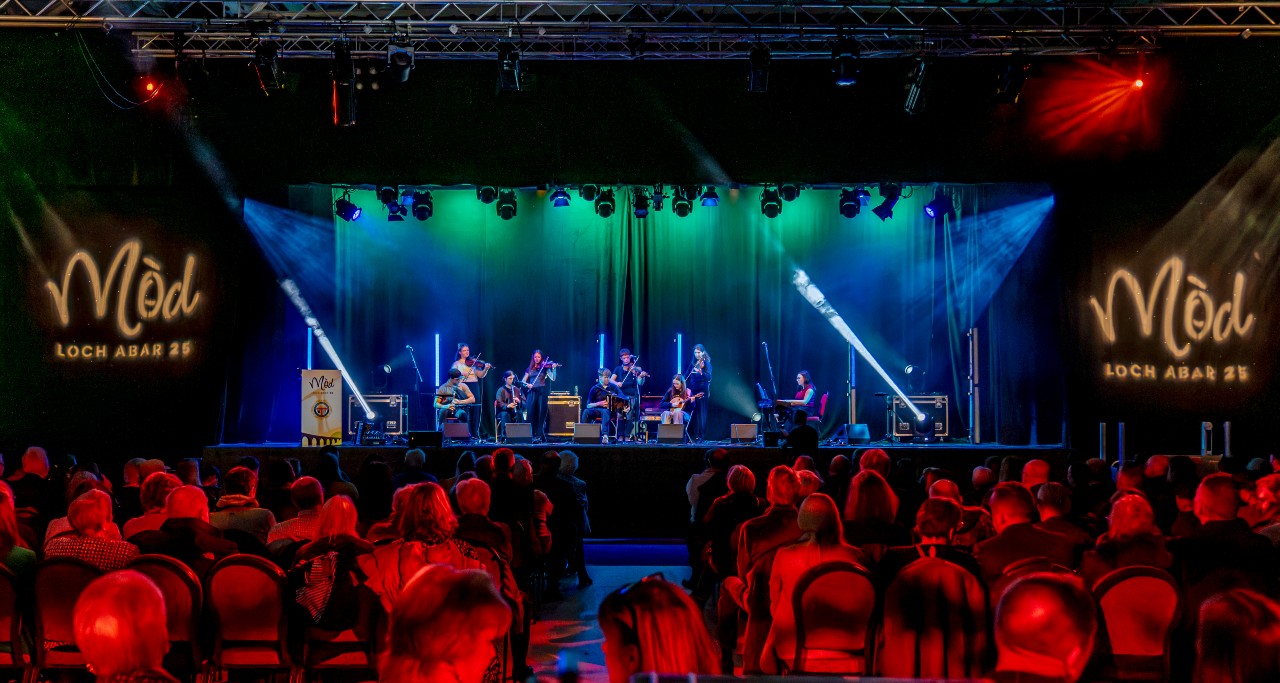 Band performing on stage at a festival