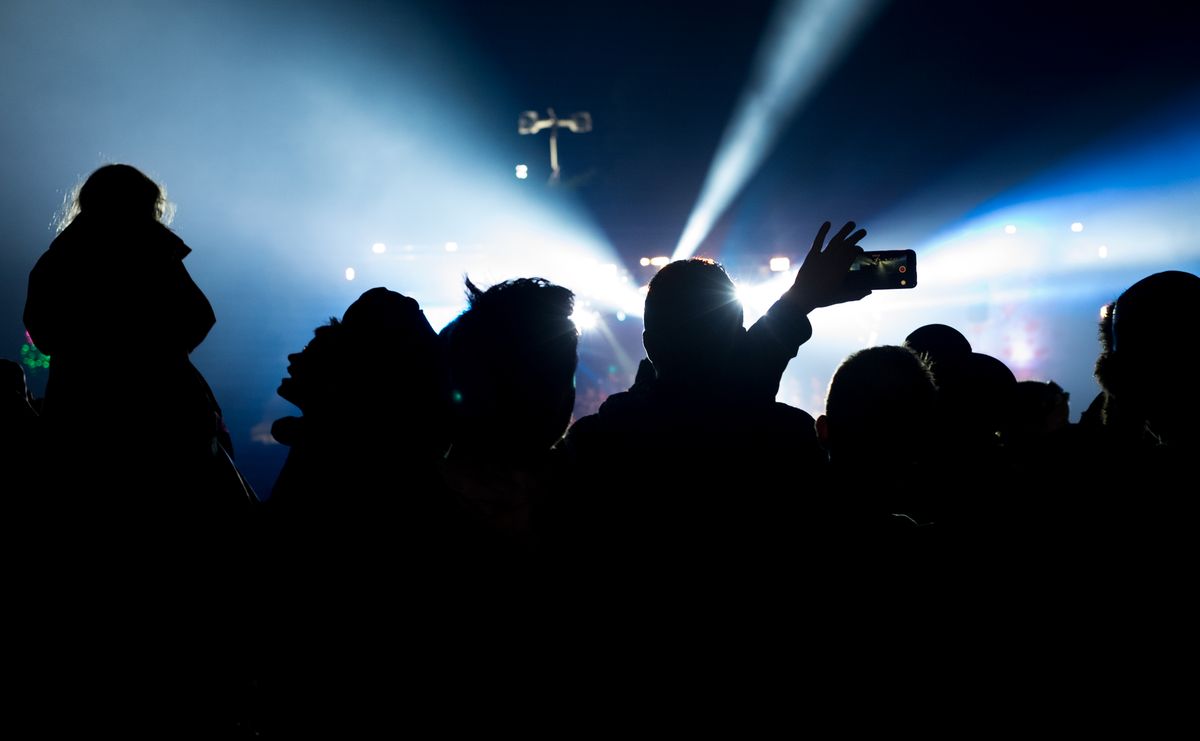 Silhouette of crowd at a festival.