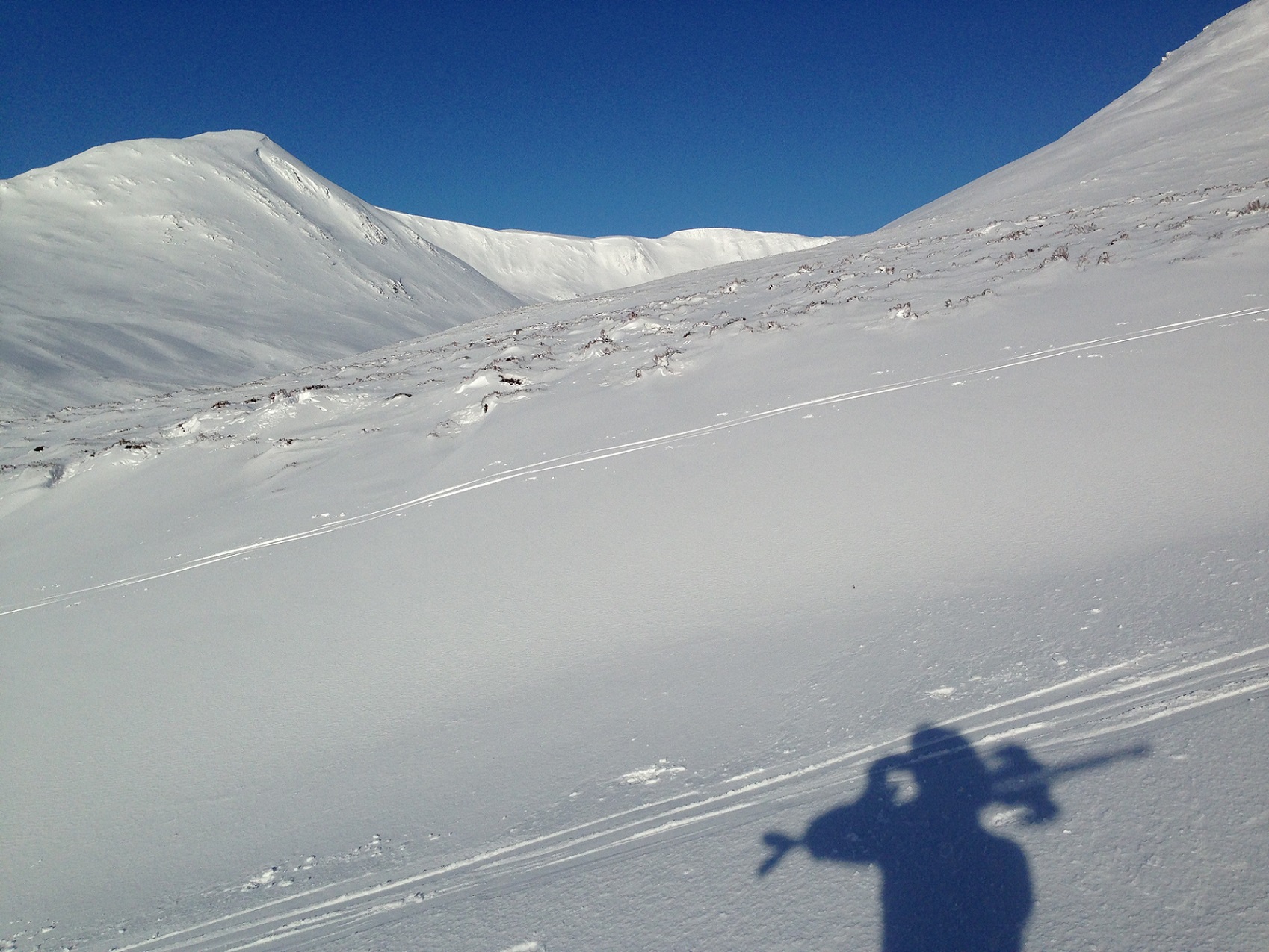 Shadow on ski-slope.