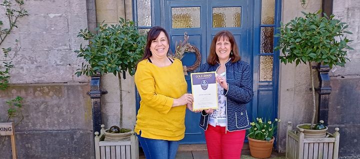 Melanie Allen from Nithbank Country Estate is pictured receiving the 5-Star Gold Quality Assurance Award from VisitScotland interim Regional Director Annique Armstrong