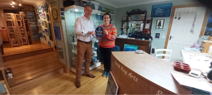 Sarah Kay being presented her award