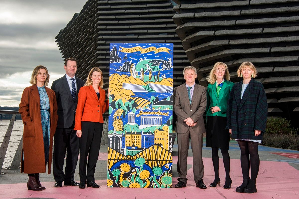 Stakeholders in the Scottish tourism sector unveil an artistic design at the lauch of Scotland's UNESCO trail
