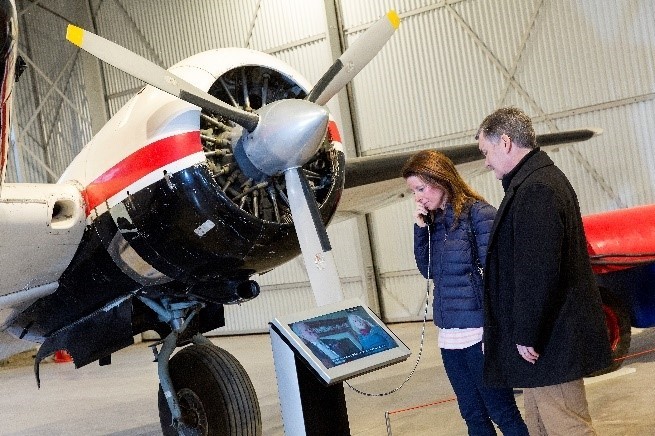 visitors looking at an interactive display at the museum of flight