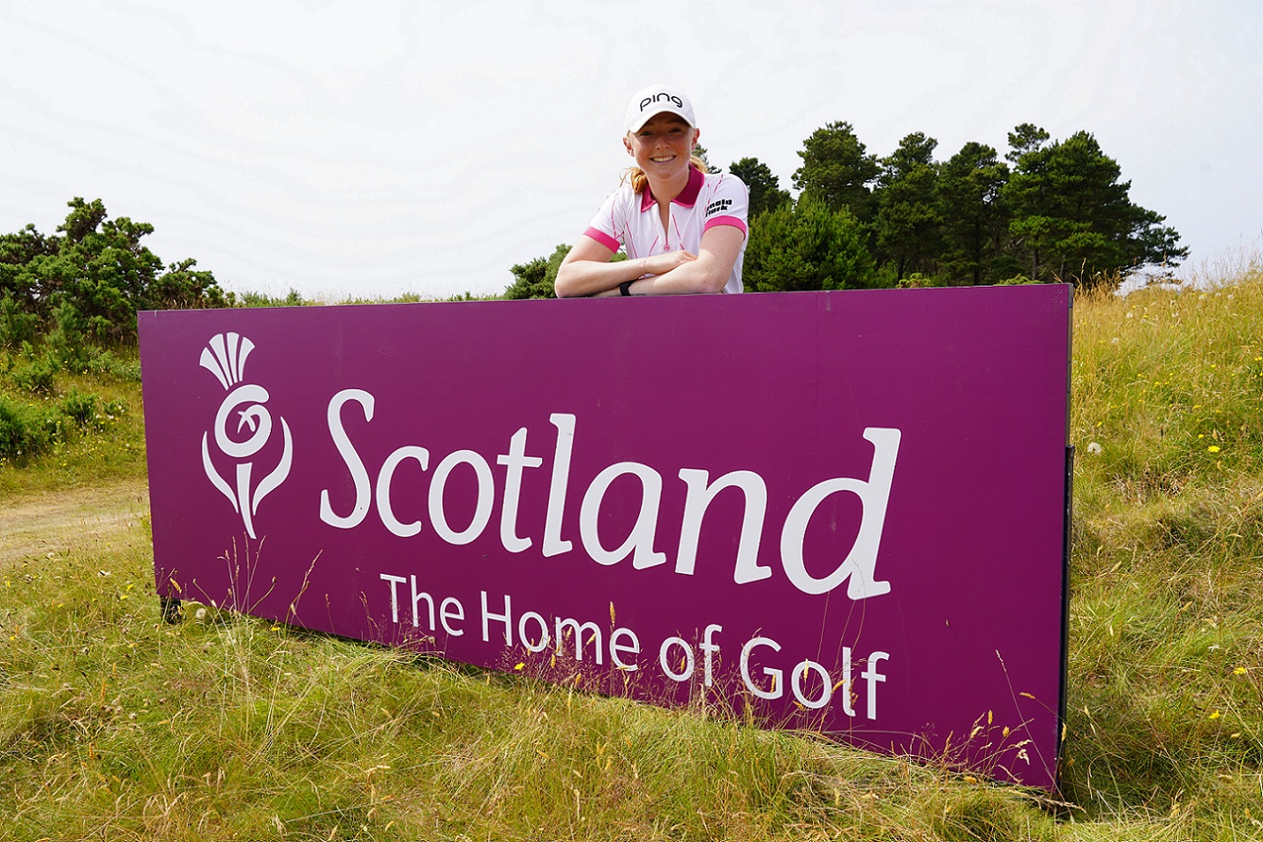 Louise Duncan with Scotland, Home of Golf sign