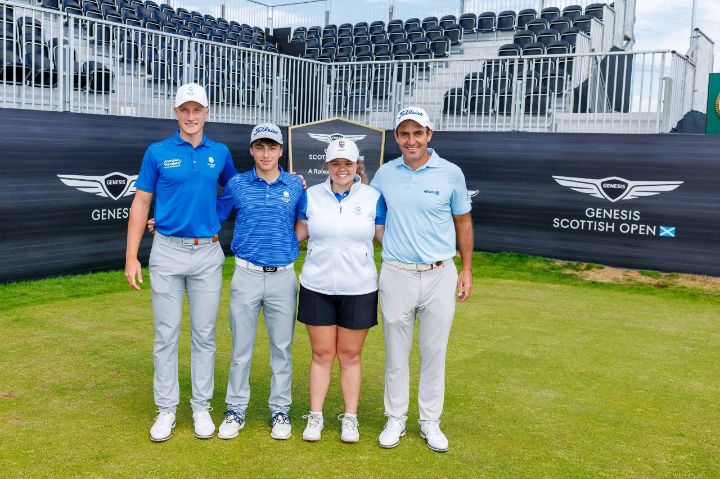 Amateur and professional golfers posing together on a golf course
