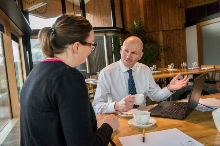 Two people are conducting a business meeting