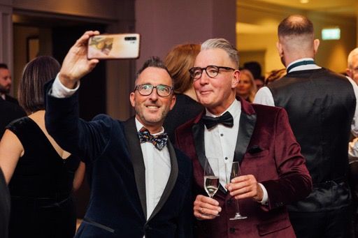 Guests at final taking selfie