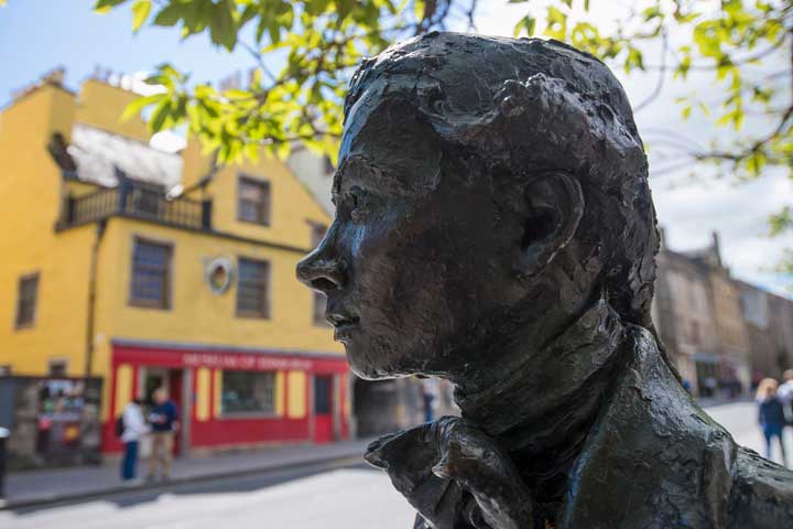 Statue of Robert Fergusson at the gates of Canongate Kirk