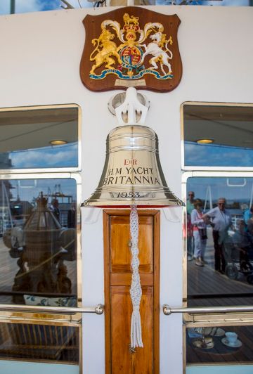 A large gold bell on board a ship